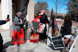 Seraphine Warren, center left, is embraced by state Sen. Shannon Pinto outside the state capitol building on Feb. 4, 2022, in Santa Fe, N.M. (AP Photo/Cedar Attanasio, File)