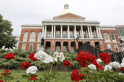 Flowers adorn the lawn in front of the Massachusetts State House, July 24, 2024, in Boston. (AP Photo/Mary Schwalm, File)